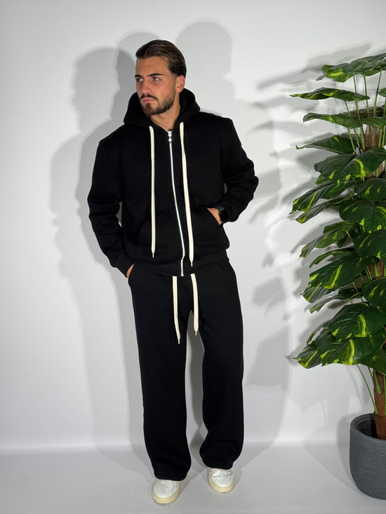 Tuta fondo ampio con zip