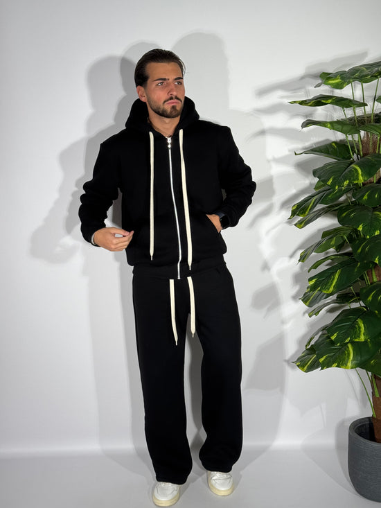 Tuta fondo ampio con zip